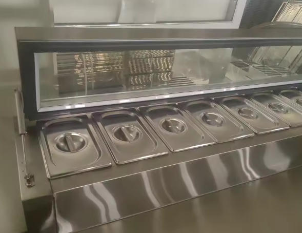 This is what our salad bar refrigerator looks like when it's facing the customer.